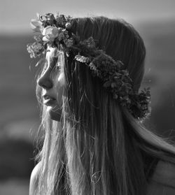 Close-up of woman wearing flower headband