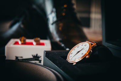 Close-up of clock on table