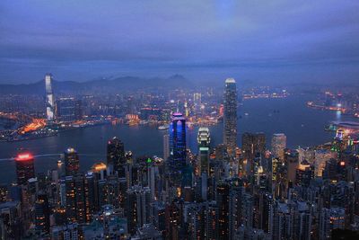 Aerial view of city lit up at night