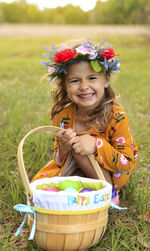 Portrait of a smiling girl sitting on grass