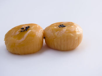 Close-up of fruit against white background