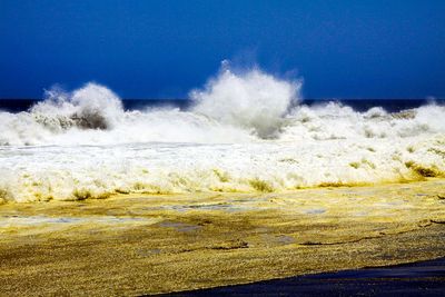 Panoramic view of sea against clear sky