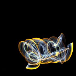 Colorful light painting against black background