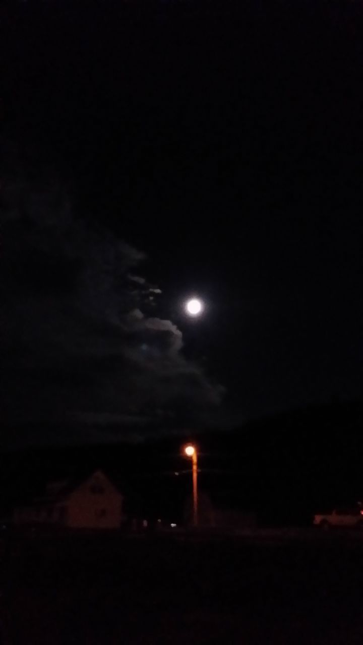 LOW ANGLE VIEW OF ILLUMINATED MOON IN SKY AT NIGHT