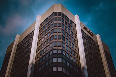 Low angle view of office building against sky