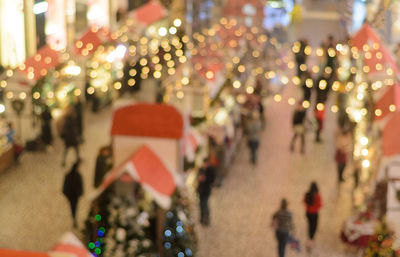 Christmas blurred background on christmas market in the mall out of focus