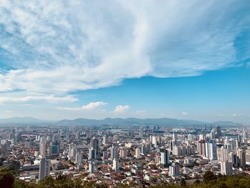 Aerial view of cityscape against sky