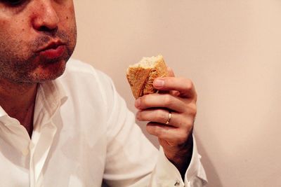 Close-up of man eating food