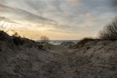 Scenic view of beach against sky during sunset