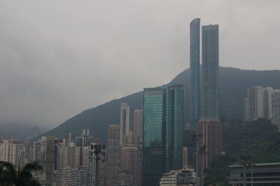 Modern buildings in city against sky