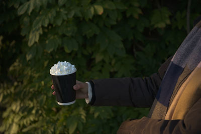 Man holding coffee cup