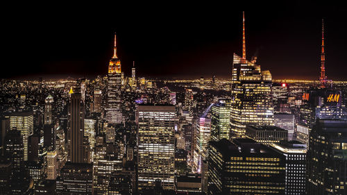 Illuminated buildings in city at night