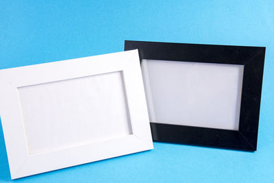 High angle view of blue paper against white background
