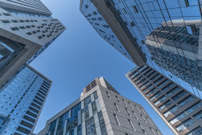 Low angle view of modern buildings against sky