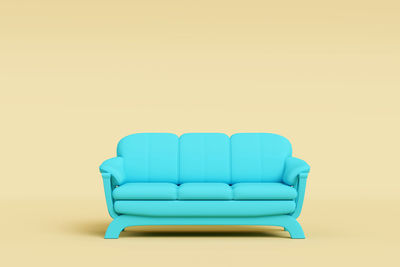 Empty chair against blue background