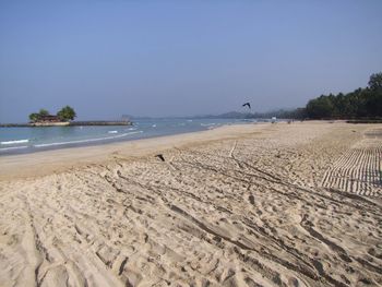 Scenic view of beach against clear sky