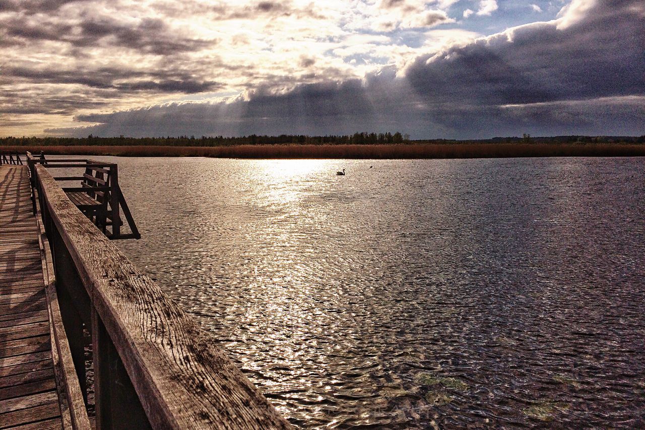 water, sky, sea, cloud - sky, tranquil scene, tranquility, scenics, transportation, nature, beauty in nature, sunset, beach, sunlight, cloud, reflection, outdoors, railing, cloudy, horizon over water, shore