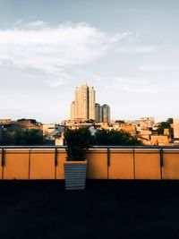 Buildings in city against sky