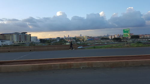 City buildings against cloudy sky