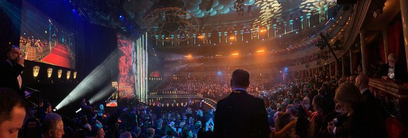 People enjoying music concert at night