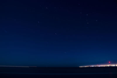 Scenic view of sea against sky at night