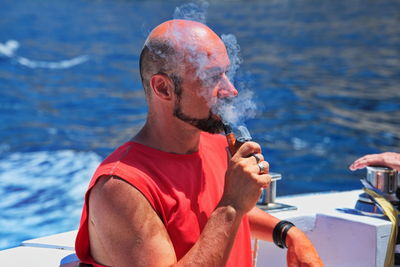 Portrait of a mature man smoking a pipe