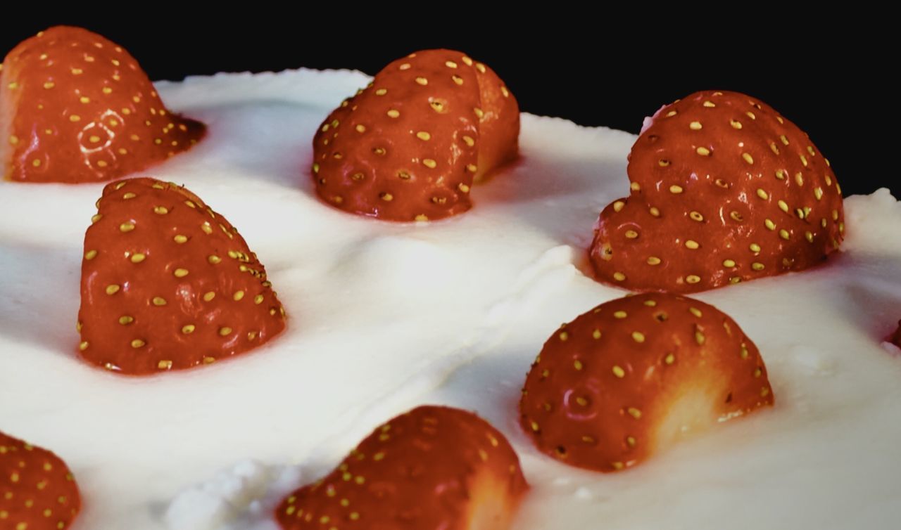 CLOSE-UP OF STRAWBERRIES IN CONTAINER