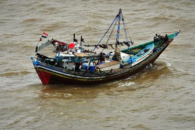 People in boat on sea