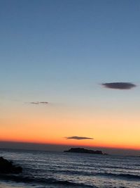 Scenic view of sea against clear sky during sunset