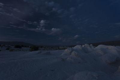 Scenic view of snowcapped landscape against sky