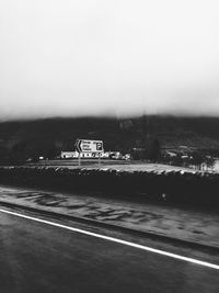Road by landscape against clear sky