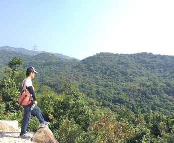 Woman standing on mountain landscape