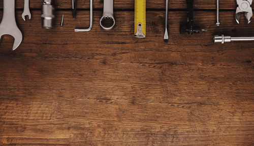 Directly above shot of tools on wooden table