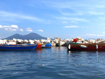 Boats moored in sea