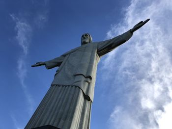 Low angle view of statue against blue sky