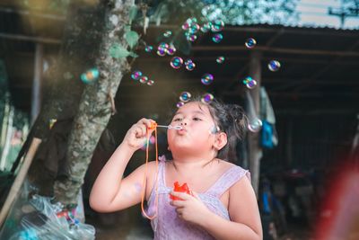 Girl blowing bubbles