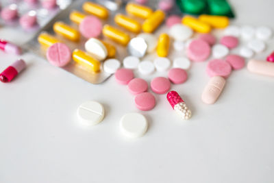 Close-up of pills on white background