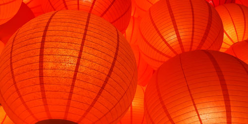 Low angle view of illuminated lanterns hanging on ceiling