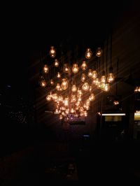 Illuminated lighting equipment hanging at night