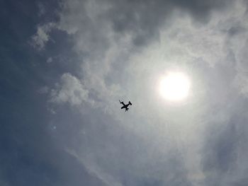 Low angle view of airplane flying in sky