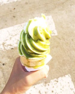 Cropped image of person holding ice cream cone