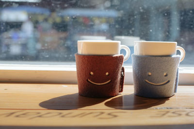 Close-up of coffee cup on table