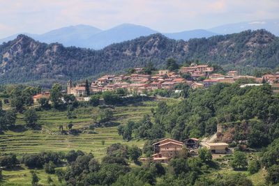 High angle view of buildings and mountains against sky