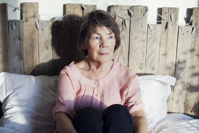 Senior woman sitting in bed