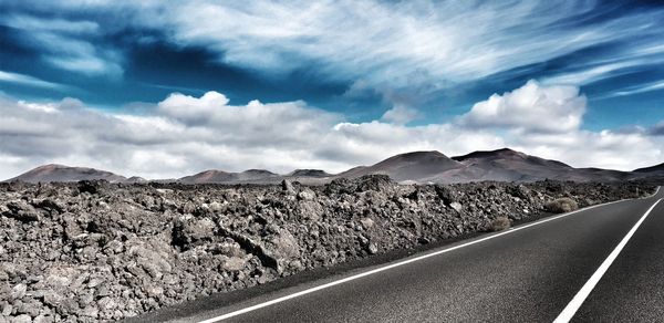 Empty road against sky