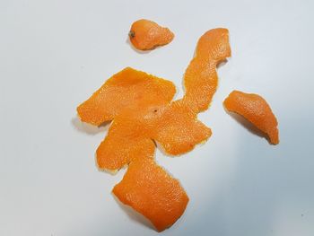 Close-up of orange fruit on white background