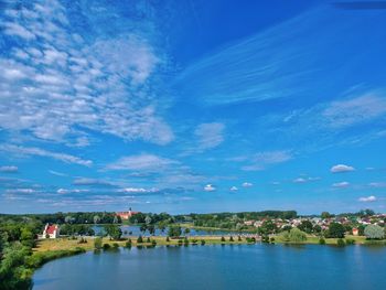 Scenic view of lake against blue sky