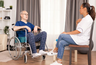 Young couple sitting on chair