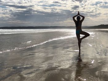 Full length of man on beach against sky