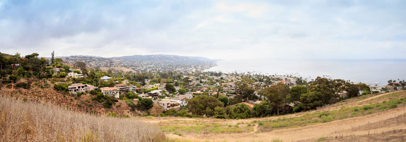 Scenic view of landscape and sea against sky